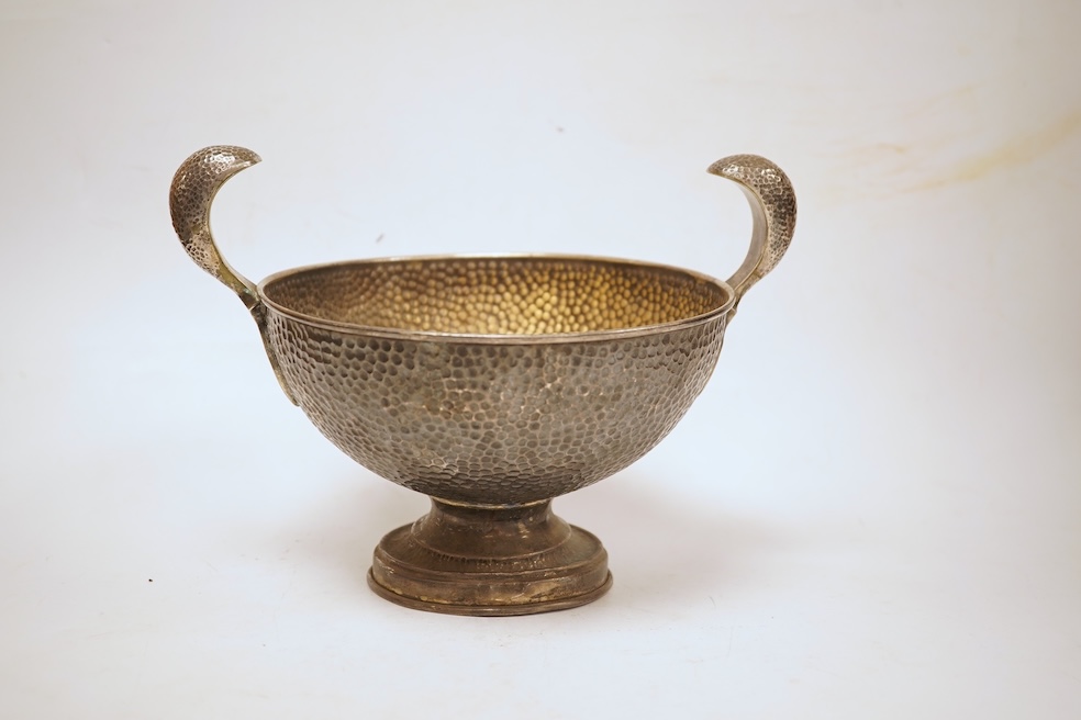 A hammered white metal two handled pedestal bowl, stamped 'Kennedy 925, diameter 18.9cm, 18.1oz.